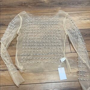 Beautiful rhinestone and pearl studded see thru top